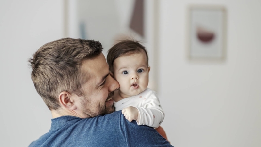 child holding parents' hand