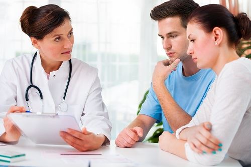 Parents talking to doctor